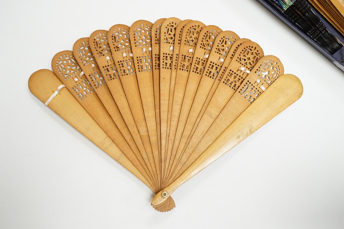 An unusual 19th century Chinese export gilt-decorated tortoiseshell and painted leaf fan, two English fans decorated with paper printed paper crests and a single sided Canton fan leaf lacking sticks, largest 23cm in leng